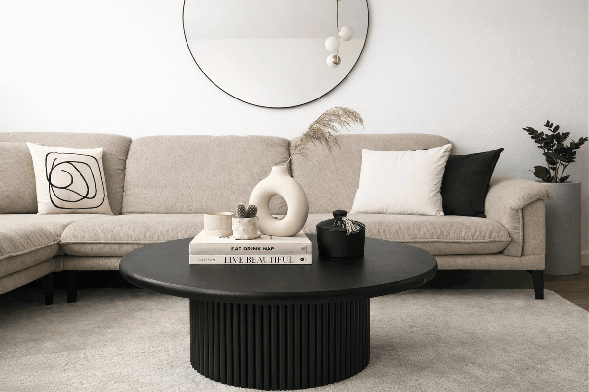 Modern round center table with decorative paint finish
